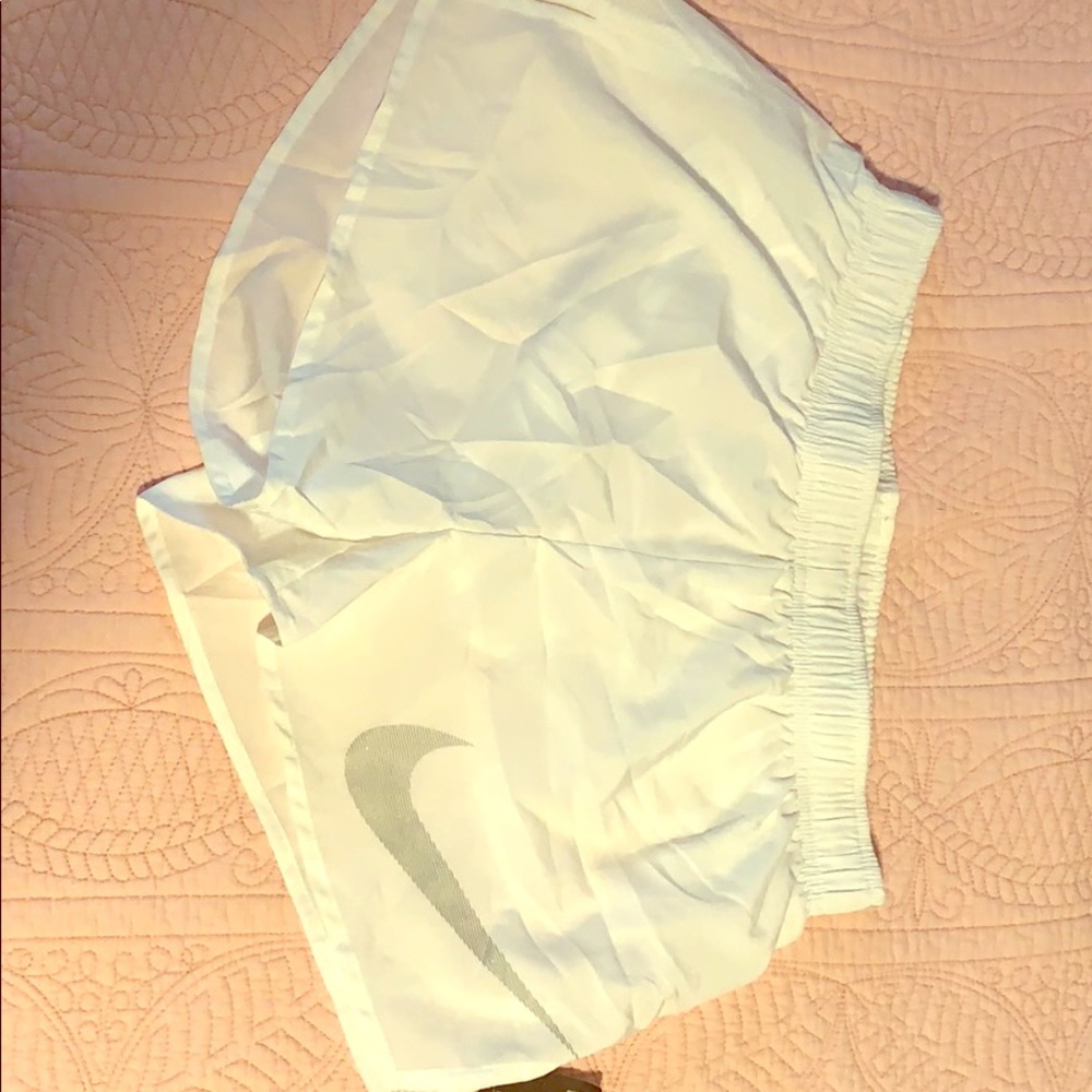 White Nike running shorts